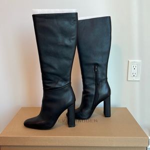 Black faux leather knee high heeled boots